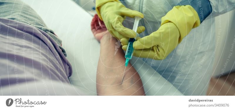 Doctor injecting a vaccine to a patient virus coronavirus syringe arm antidote covid19 vaccination header banner web panorama panoramic treatment doctor
