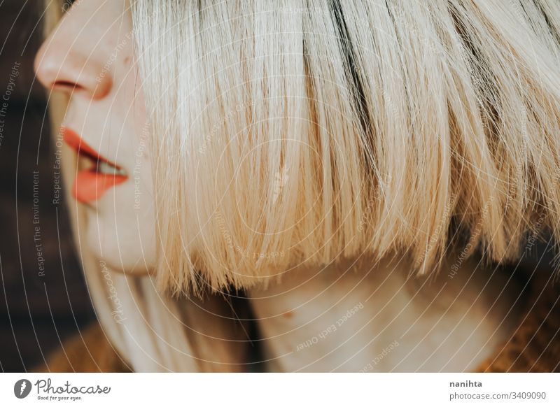 Close up of the hair and lips of a young woman hairstyle sensual close up face pretty blonde matte lipstick skin care cosmetics real part of portrait real woman