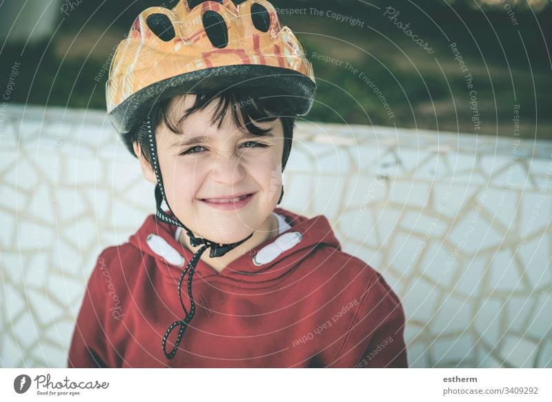 smiling Child with bicycle helmet child cyclist Protection activity cycling security sport fun Happy Happiness Smiling Smile Healthy leisure Athlete drop