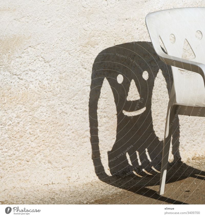 funny shadow of a plastic chair - a Royalty Free Stock Photo from Photocase