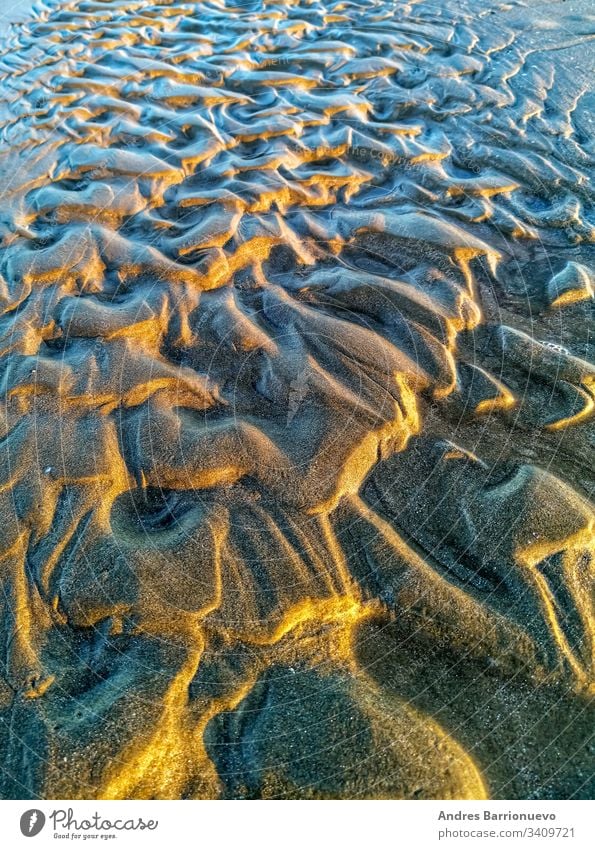 Curios formation made by water in the sand detail abstract travel waves sea sandy dune natural dry coast ground light texture drought beach surface hot shadow