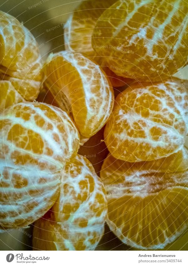 View of small peeled oranges food natural delicious fresh fruit health sweet nutrition tangerine green mandarins pile of oranges small orange healthy tropical
