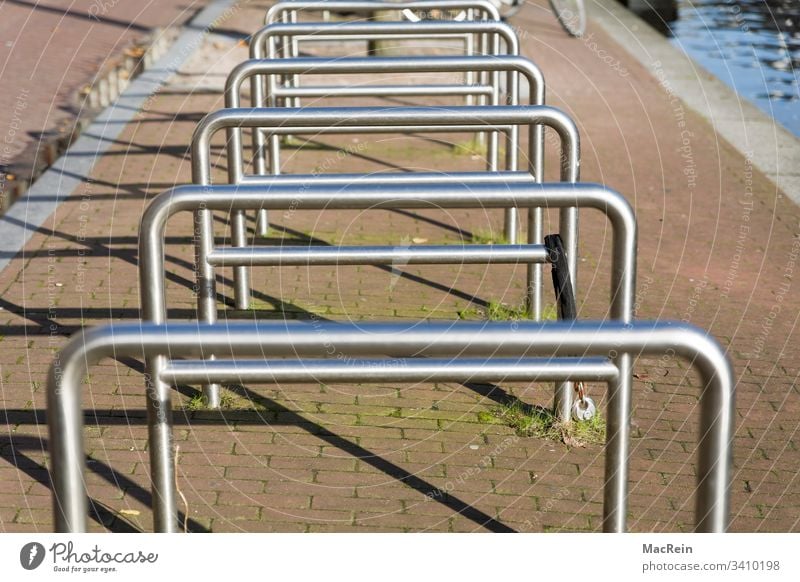 bicycle stands Bicycle rack bicycles bike Keep Lean switch off Parking lot Handrail steel pipe Metal nobody Copy Space