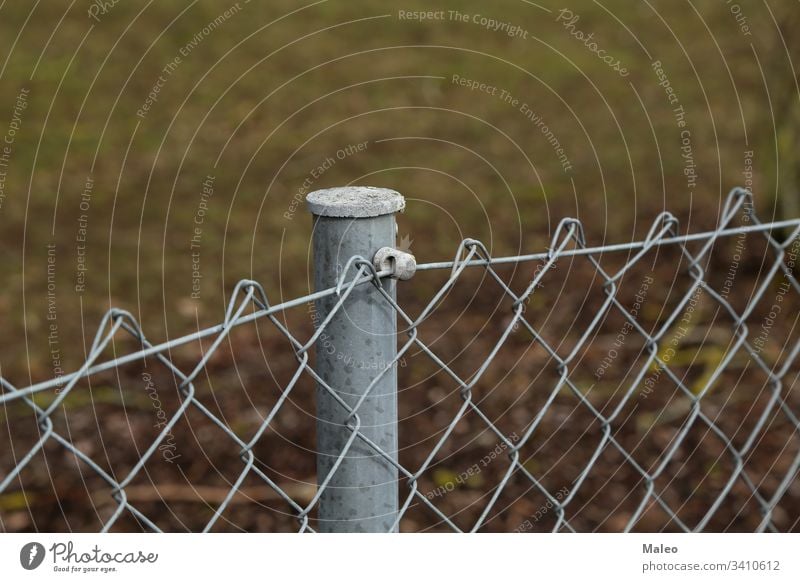 Fence made of metal posts and metal mesh pole steel construction pattern barrier fence protection wire danger building fencing design safety enclosure warning