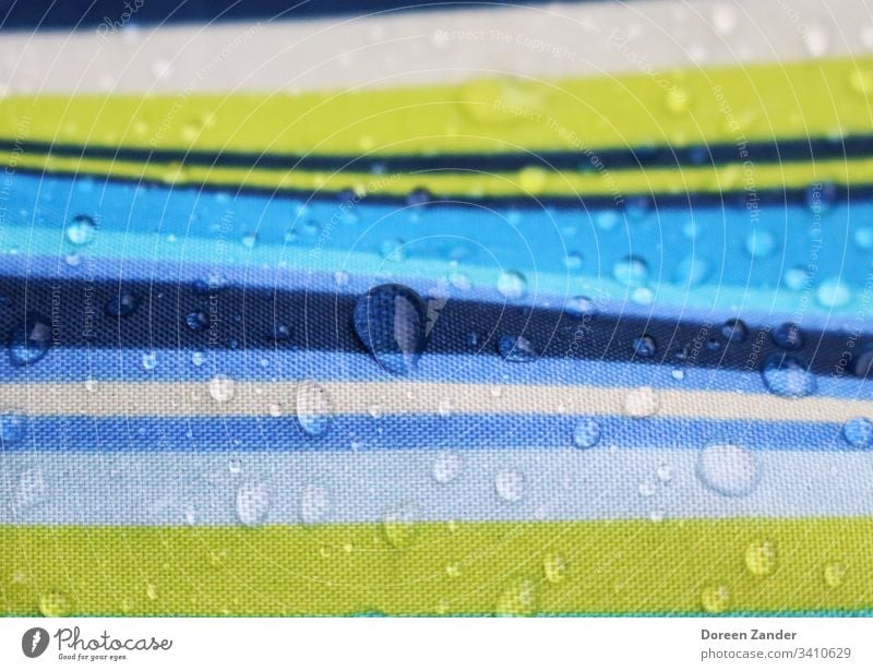 Drops of water on an umbrella raindrops Exterior shot Nature Rain background Water Umbrella Wet Colour photo Weather Close-up Day Bad weather Striped Detail