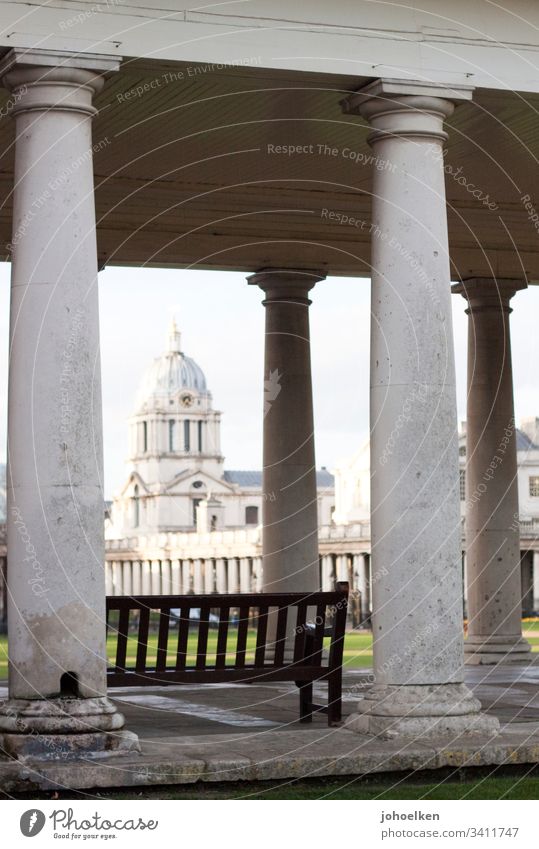 Dome behind columns London Greenwitch naval collage domed building Bench marble Lawn portico