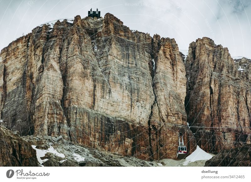 Rock face with cable car in the Dolomites Mountain Hiking South Tyrol Climbing Wall of rock Colour photo Relaxation Bizarre Effort Adventure Enthusiasm Gray
