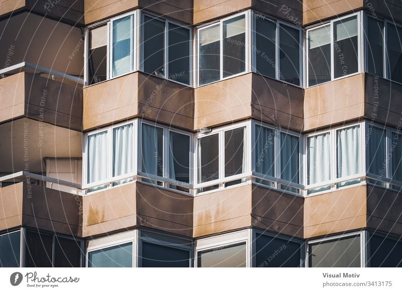 Balconies of an urban residential building facade windows balconies architecture architectural architectonic concrete color structure geometric geometrical