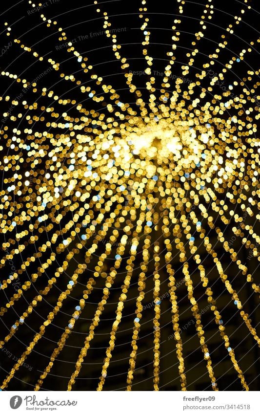 Unfocused bokeh texture from the christmas lighting abstract blurry glistering bright gold background shiny holiday blurred celebration shine glowing decoration