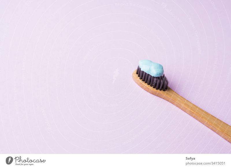 Bamboo toothbrush on pink pastel background hygiene bamboo dental toothpaste blue personal lilac concept spring teeth trendy oral modern minimal zero waste