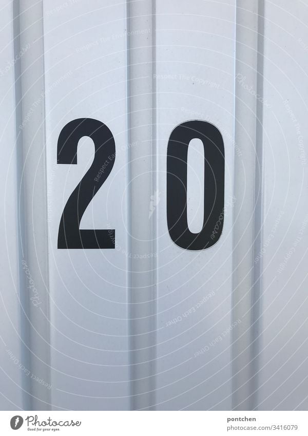 Black number 20 on corrugated iron garage door 2020 Corrugated sheet iron Garage door Colour photo Deserted Digits and numbers Copy Space top Copy Space bottom