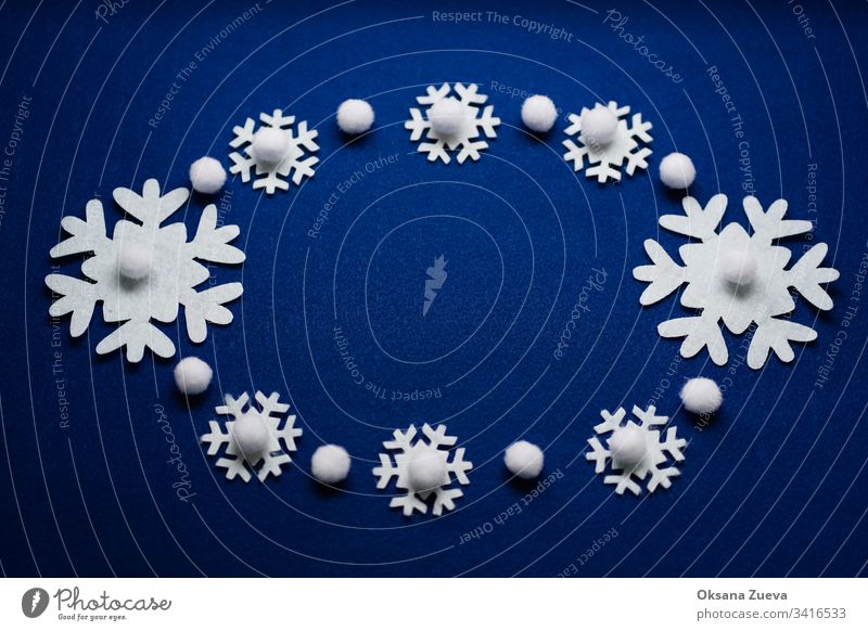 Christmas composition. Pattern made of snowflakes on blue background. Christmas, winter, new year concept. Flat lay, top view, copy space above art ball bright