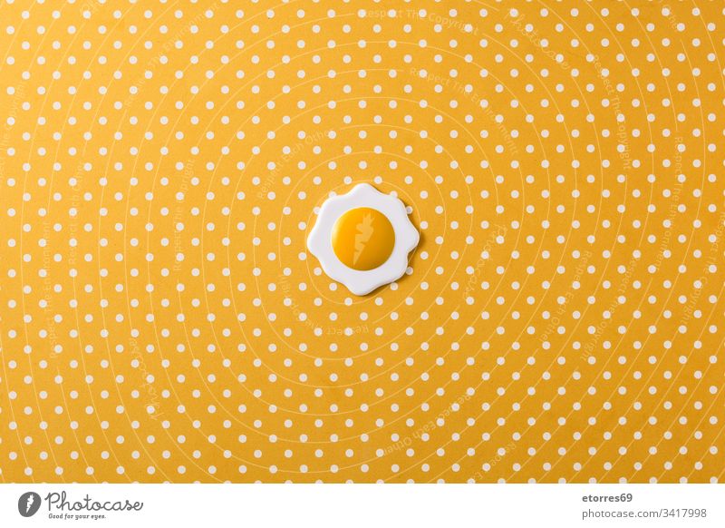 Minimalist fried egg on yellow background with white circles. Top view color concept cooked crockery diet food kitchenware minimalist nutrition object protein