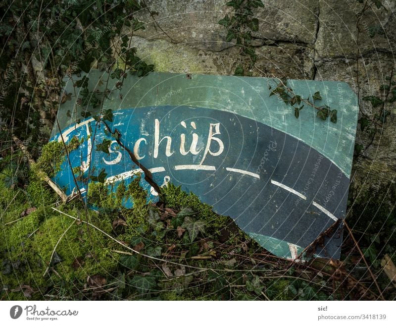 Farewell sign at a factory ruin in Saxony-Anhalt Bye End Street Goodbye Farewell party Green Turquoise Moss Ivy Ruin Stone Exterior shot Deserted Subdued colour