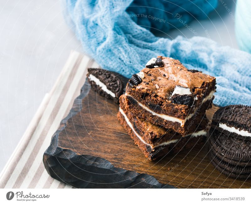 Cream cheese brownies with cookies square bar cake cream layer chocolate traditional american dessert treat festive delicious bake home made sweet food blue pie