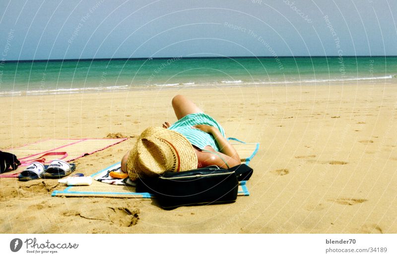 Lazy on the beach Canaries Fuerteventura Beach Woman Ocean Summer Physics Europe Sun Sunhat white sand pumpkins Warmth