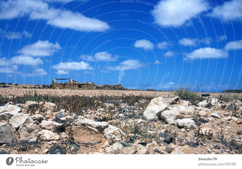 Ruin on the horizon Horizon Gravel Badlands Loneliness Drought Fuerteventura Canaries Wide angle Europe Stone Sky Blue Desert