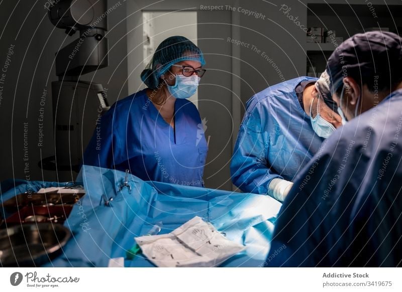 Medical staff during surgery in modern clinic surgeon hospital medic medicine doctor treatment surgical nurse work medical practitioner people specialist