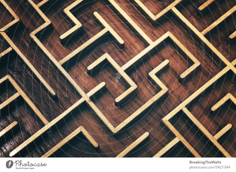 Wooden brown labyrinth maze puzzle close up Labyrinth toy wooden closeup elevated high angle view complex way find think game metaphor concept background route