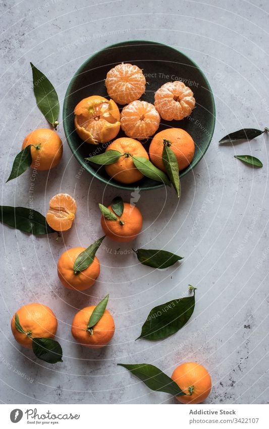Fresh mandarins fruits on table tangerine citrus fresh orange natural peel leaf bowl food tasty delicious juice organic healthy sweet ripe vitamin vegetarian