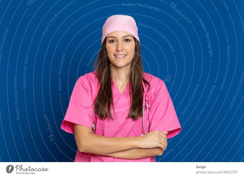 Young doctor with a pink uniform disease illness woman breast cancer happy smile joyful positive relaxed health female care review scarf stethoscope medical