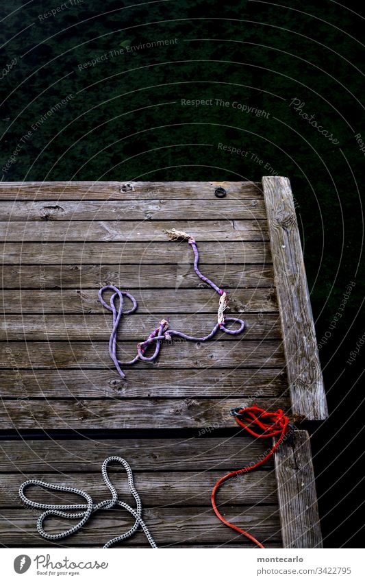 rope shaft | discarded Day Copy Space top Deserted Exterior shot Colour photo String Rope Light Old Thin Environment jetty Wood broken Broken Defective