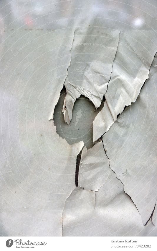 paper with hole behind glass pane Paper Wrapping paper Torn Crack & Rip & Tear cracks Broken Hollow Slice Window Shop window reflection structure texture