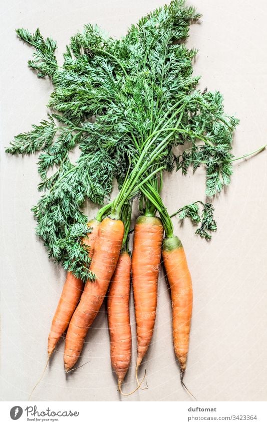 a bunch of carrots with green Nature Yellow turnip Rural organic Vegetable Carrot baby carrot Natural Fresh Healthy Food Vegetarian diet Nutrition