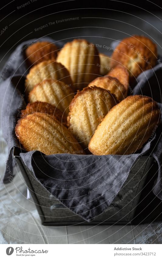Basket with Madeleine cookies on table food madeleine tradition bake sweet pastry tasty fresh dessert homemade delicious meal nutrition baked cuisine yummy
