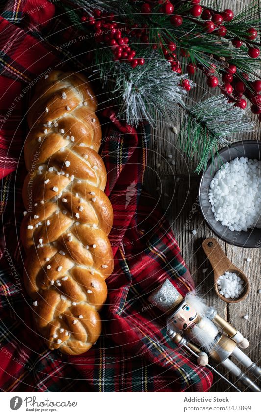 Christmas braided bread on table with decoration christmas food fresh cut tradition meal celebrate tablecloth winter appetizing cook crunch product dough wheat