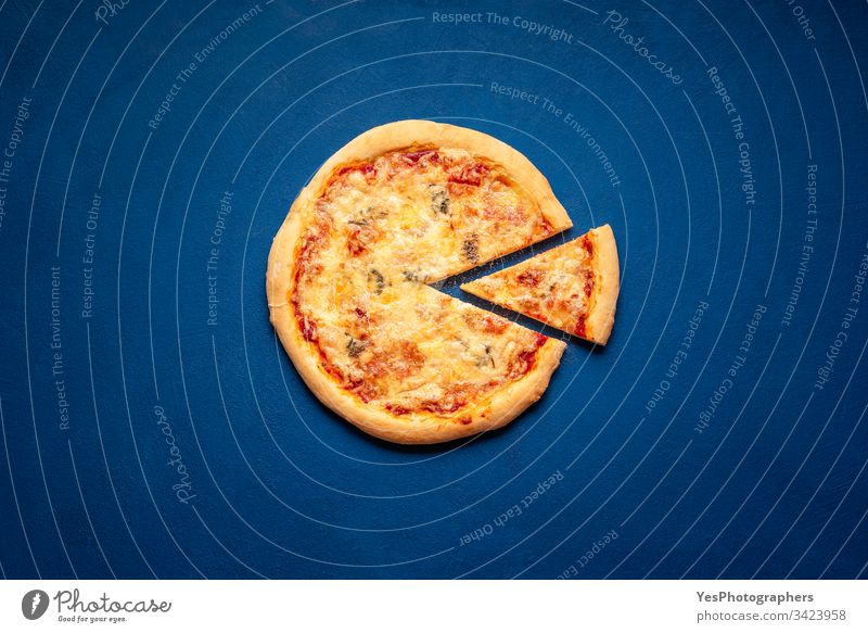 Four cheese pizza on classic blue table. Pizza slice flat lay 4 cheese pizza Italian above view baked carbohydrates carbs crust cuisine dinner european famous