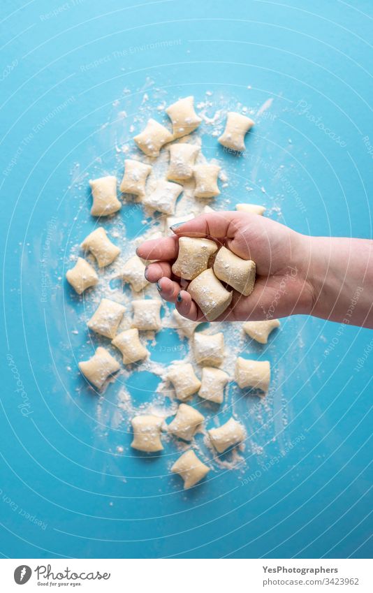 Gnocchi dumplings uncooked. Cheese gnocchi in hand Italian above view blue cheese cooking cuisine diet dinner european flat lay flour food fresh gastronomy