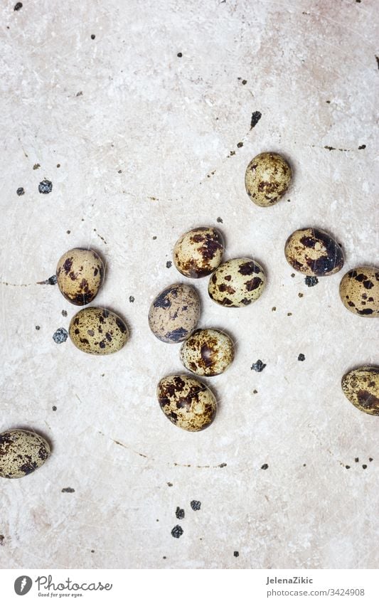 Quail eggs on light background organic food quail small shell protein ingredient easter raw product group bird nature cuisine natural fresh brown healthy diet