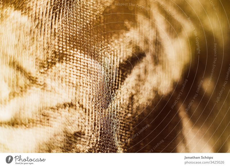 Texture of shiny gold background foil bright close up glamorous glaring glossy golden lustrous material nacreous photographic equipment shine sparkle texture