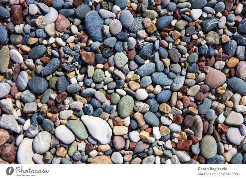 Closeup of the beach pebbles background nature summer stone texture smooth coast rock surface abstract material seaside gravel dry heap colorful natural