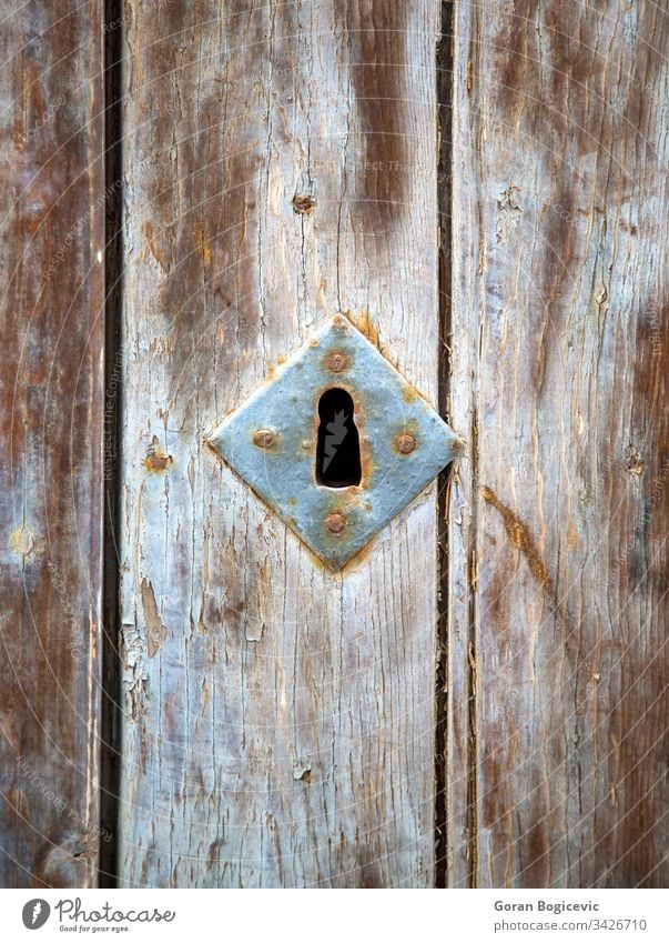 Old keyhole security vintage door old safe metal antique rusty ancient wood wooden metallic home texture detail copper entrance closet
