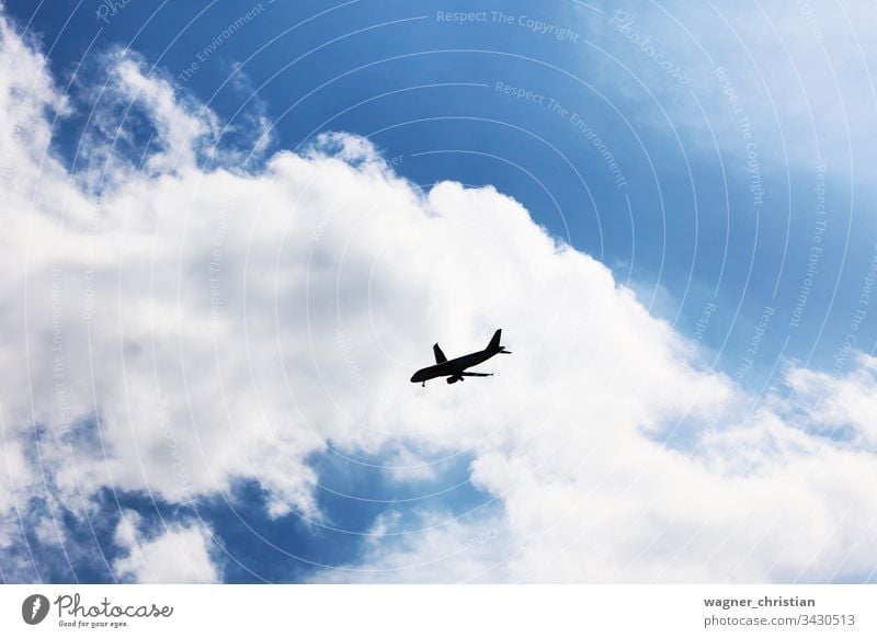 Approaching Airplane Silhouette airplane silhouette silouette approaching landing crisis flight transportation business sky background clouds aeroplane aircraft