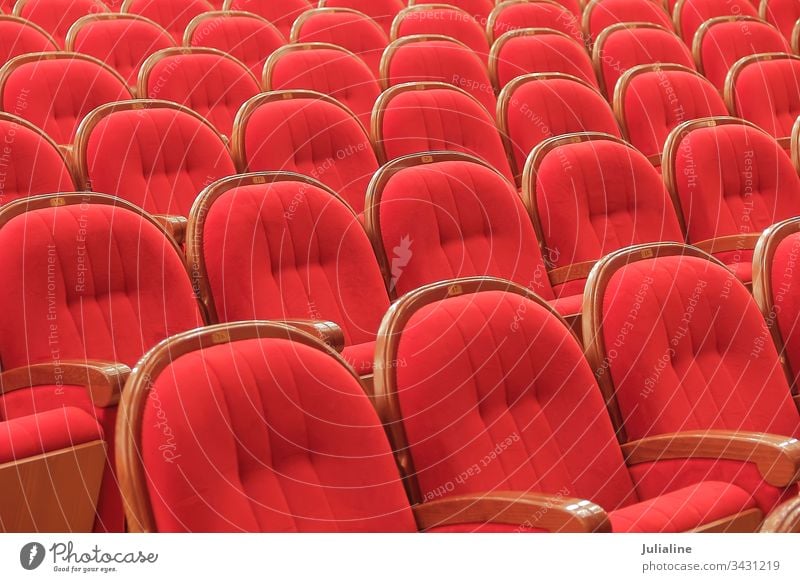 Background of red theatrical red chairs theater theatre interior seat empty arts performance nobody row stage auditorium indoors armrest velvet background