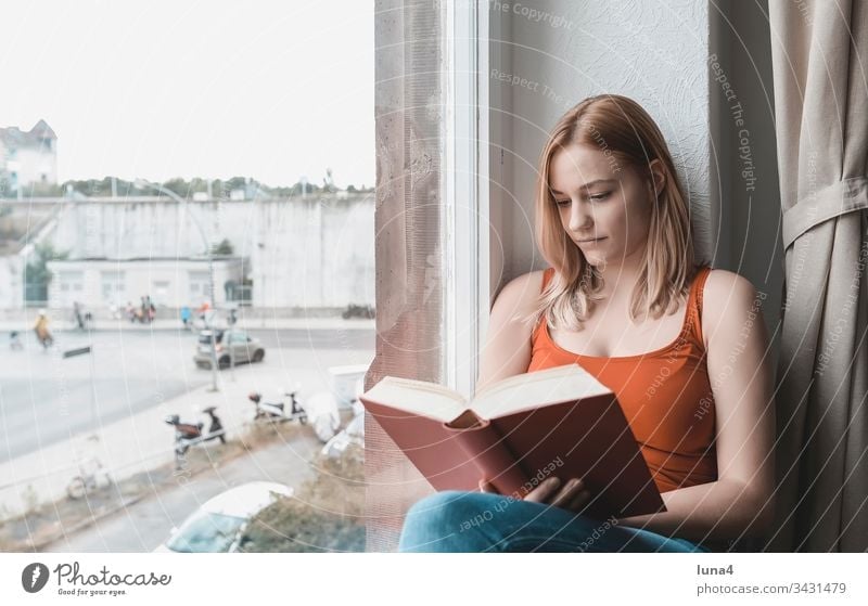 young woman reading book at window Woman Book Reading Study Window study Dreamily room Education melancholically Meditative Smiling sensual To enjoy at home