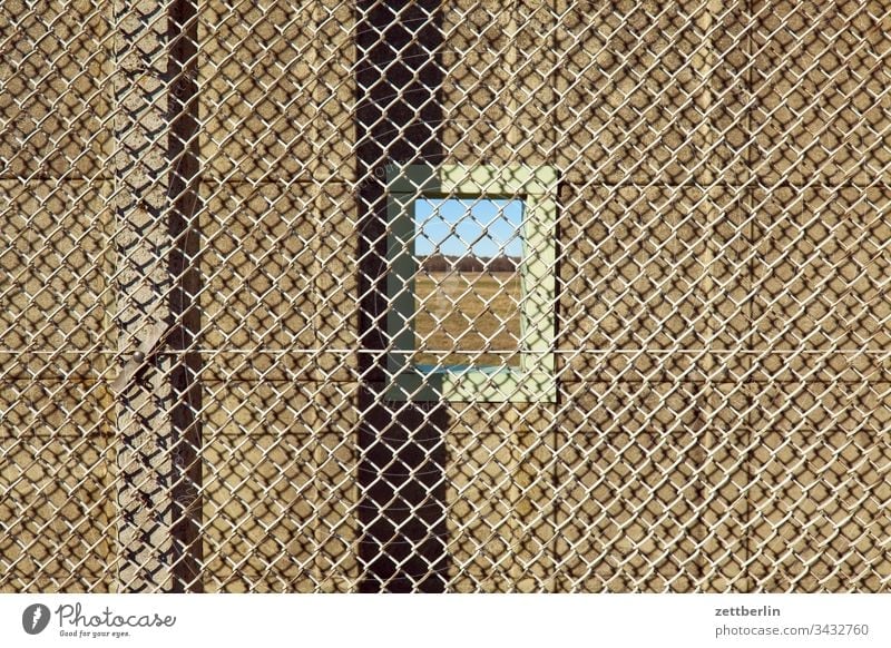 Windows in the wall on the outside Deserted Copy Space Wall (barrier) Border Barbed wire foreclosure Real estate Fence Exclusion demarcation NATO wire Backup