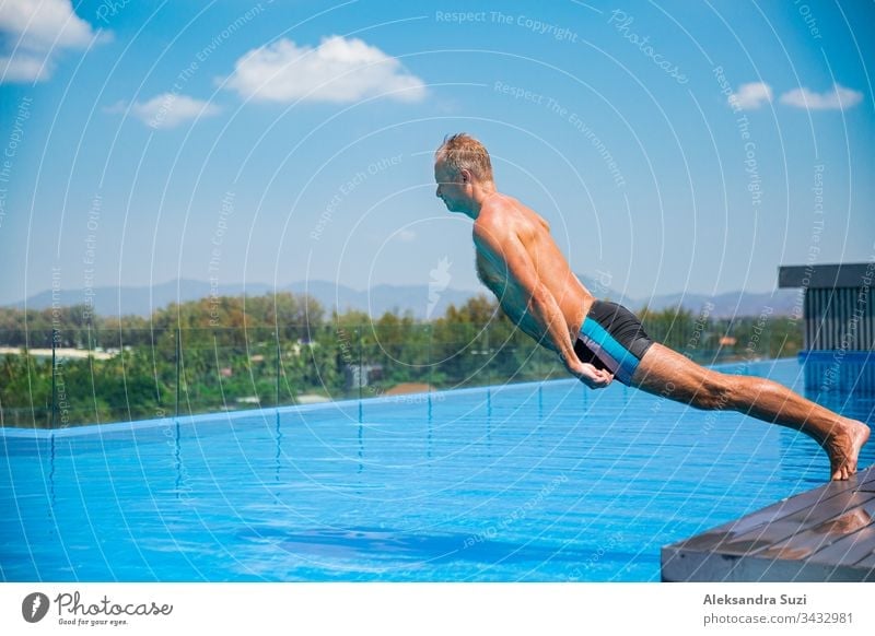 Unemotional funny man falling into swimming pool. Summer vacation action active activity adult blue boring crazy crisis despair exhausting fatigue frustrated