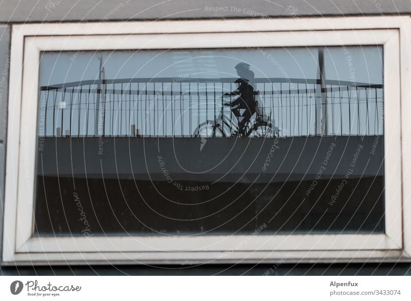 Divided Personality Window Bicycle House (Residential Structure) Window pane Cycling Exterior shot Colour photo Bridge railing Human being Means of transport