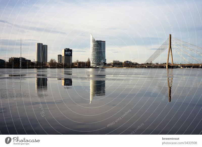 View over the river Düna in Riga, Latvia River reflection Water Bridge skyscrapers