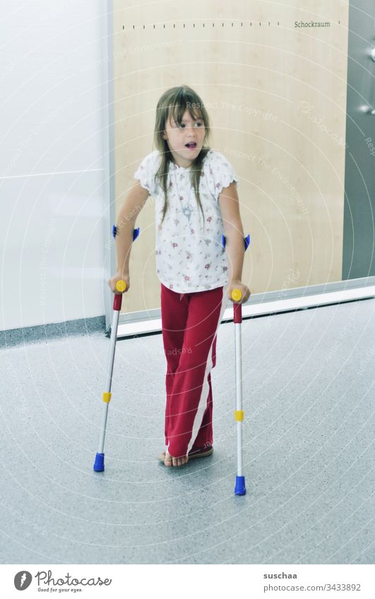 little girl on crutches in hospital Child Girl Walking Crutches Hospital violation Accident Medical treatment Barefoot colored Shock Room writing