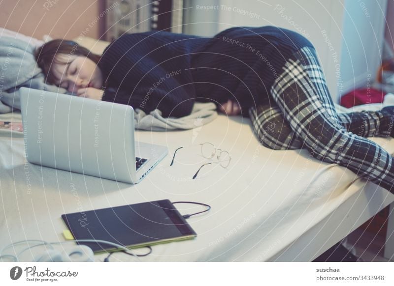 home office | corona thoughts teenager Youth (Young adults) Young woman tired at home Bed Sleep laptop Eyeglasses Drawing tablet labour stay at home Crisis