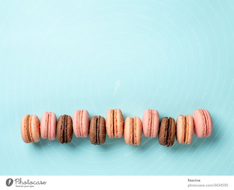 Macarons on blue, copy space top macaron macarons on blue macarons row macaron row macaroon background flat lay frame french confectionery biscuit flavor