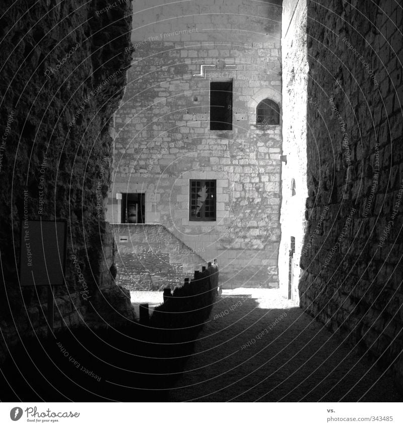 Sunny dungeon. Old town Castle Ruin Manmade structures Architecture Wall (barrier) Wall (building) Facade Tourist Attraction Monument Hope Black & white photo