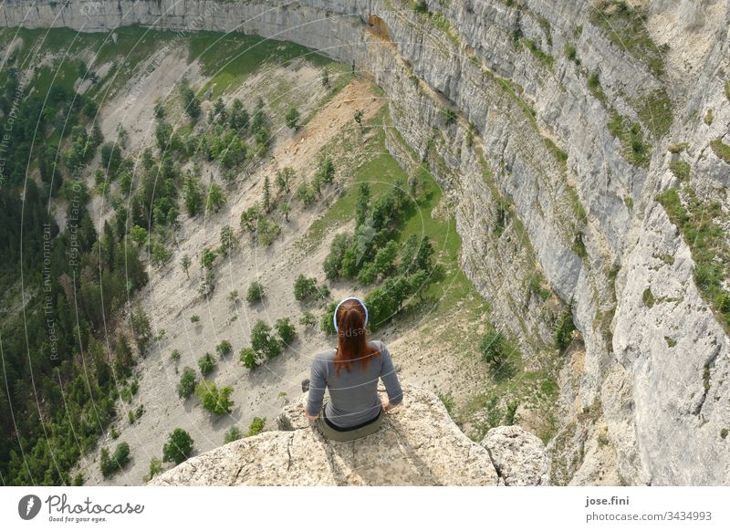 Woman sitting on a rocky outcrop and contemplating nature Human being 1 person feminine Nature Love of nature Rock Wall of rock rocky landscape trees Landscape
