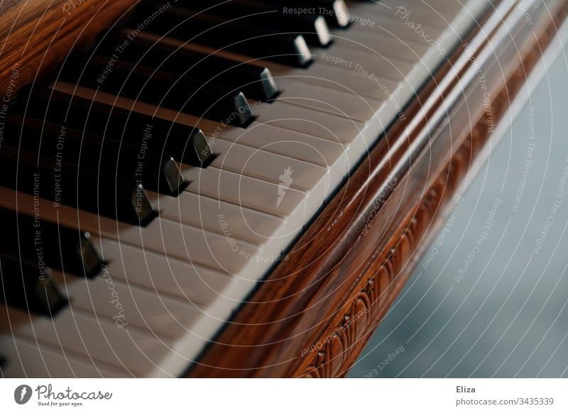 Close-up of a beautiful wooden piano and its keys Piano Wood fumble piano grand Playing the piano musical pretty ornaments Music Musical instrument Detail