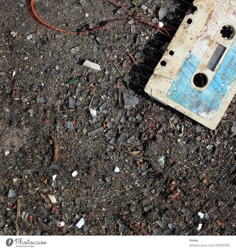 cute little dirty audio tape Plastic Shadow Sunlight Imprint filth Dirty frowzy detail lines Surface Trashy Broken sandy tar soil cassette audio cassette
